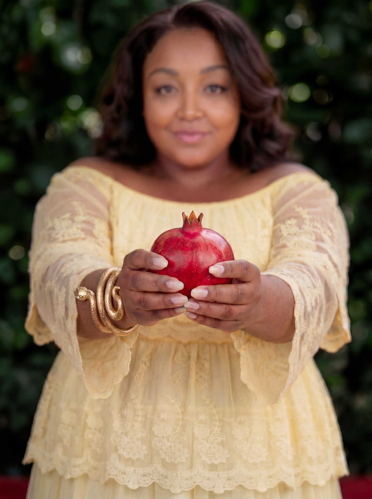 Deborah McDaniel holding a pomegranate